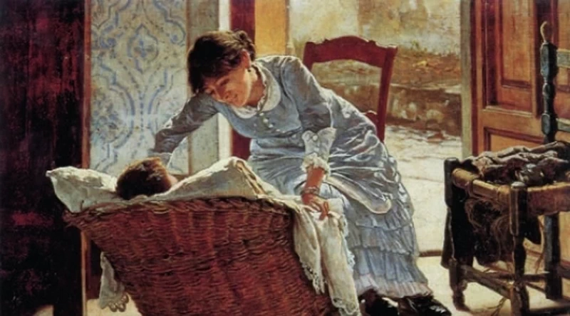 Giovane donna che culla un bambino